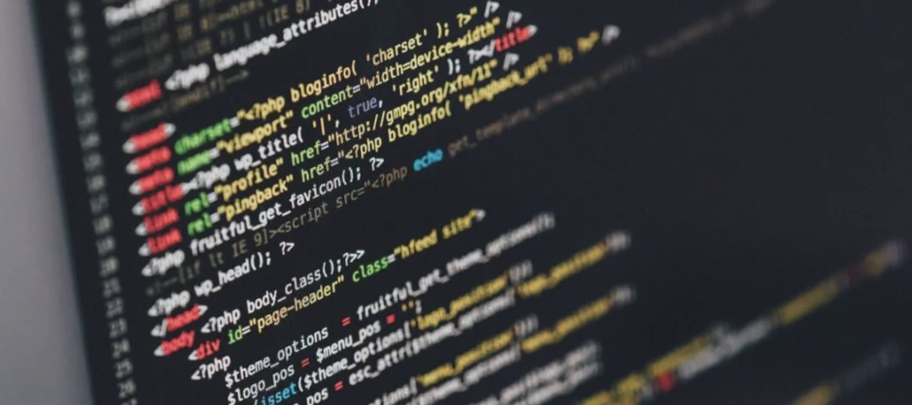 The image shows a computer screen with a lot of coding on a black background