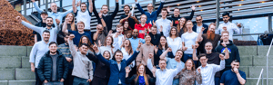 UNIwise group photo with people cheering excitedly