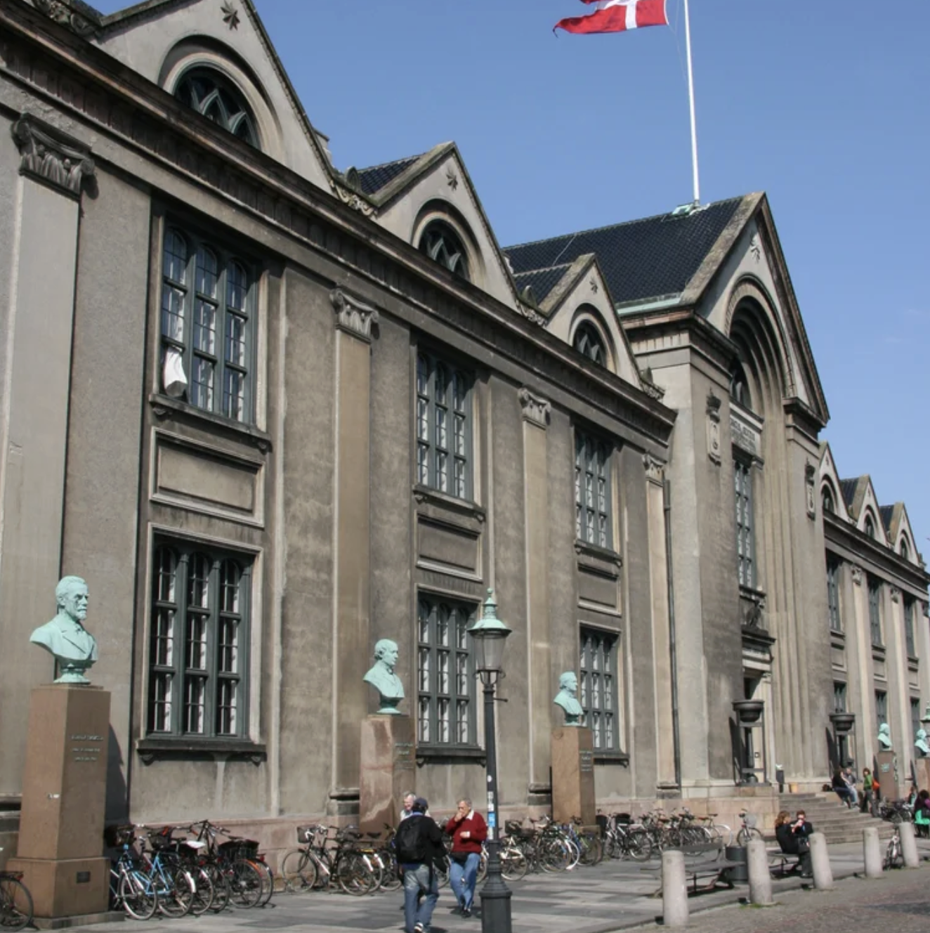 A significant structure of the University of Copenhagen, characterized by its extensive window design and impressive architecture.