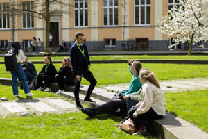 Students talking to each other in the courtyard of a university