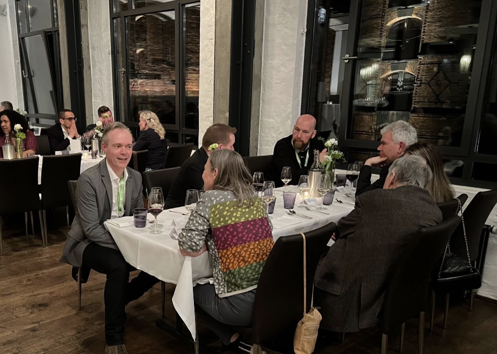 Attendees of WISEcon24 enjoying themselves over a glass of wine at the WISEcon24 dinner